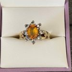 ring with citrine in centre and diamonds