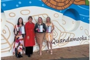 group of Redlands business women holding award certificates